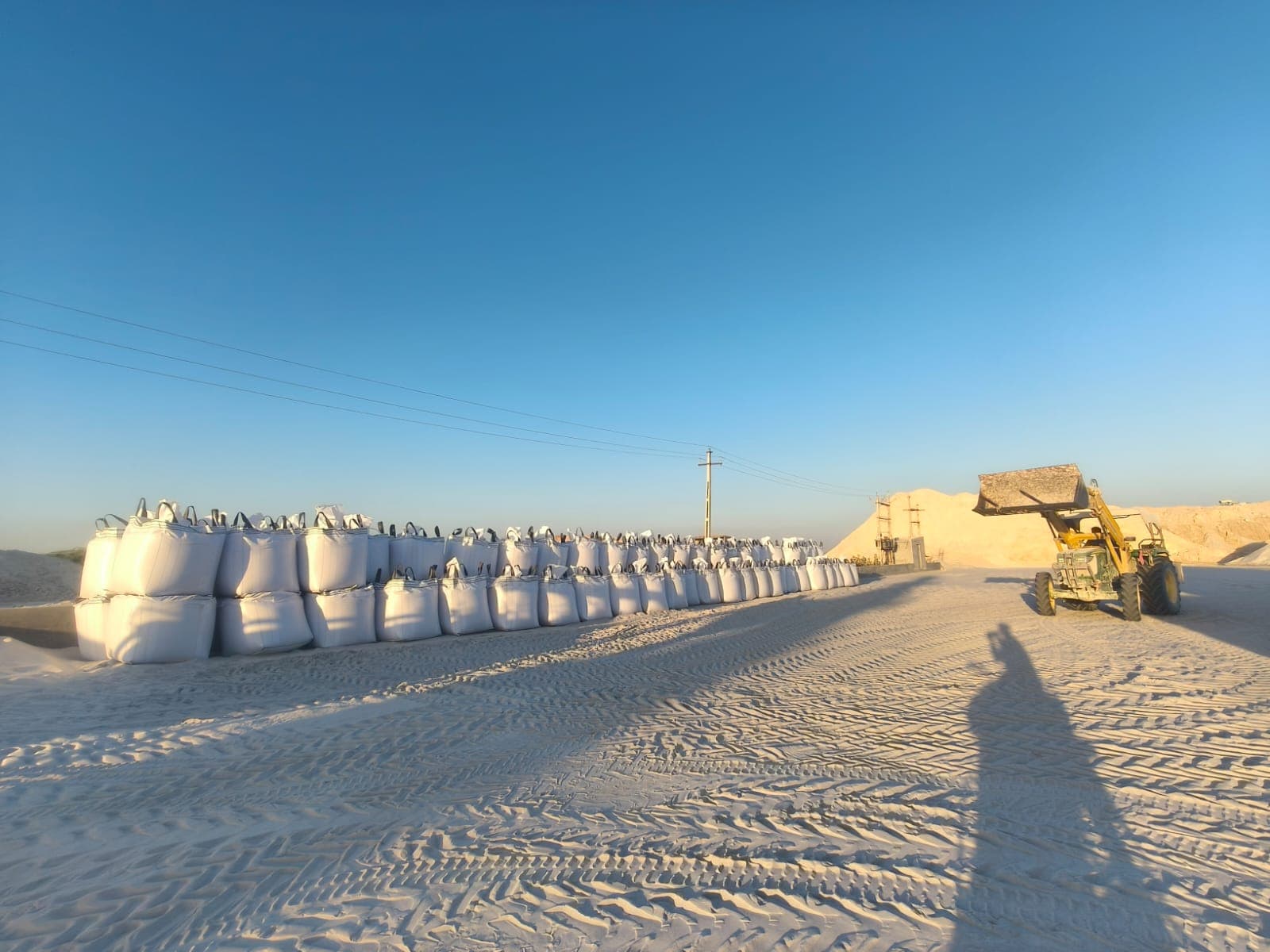 Rows of filled jumbo bags of china clay at the Mahalaxmi China Clay stockyard