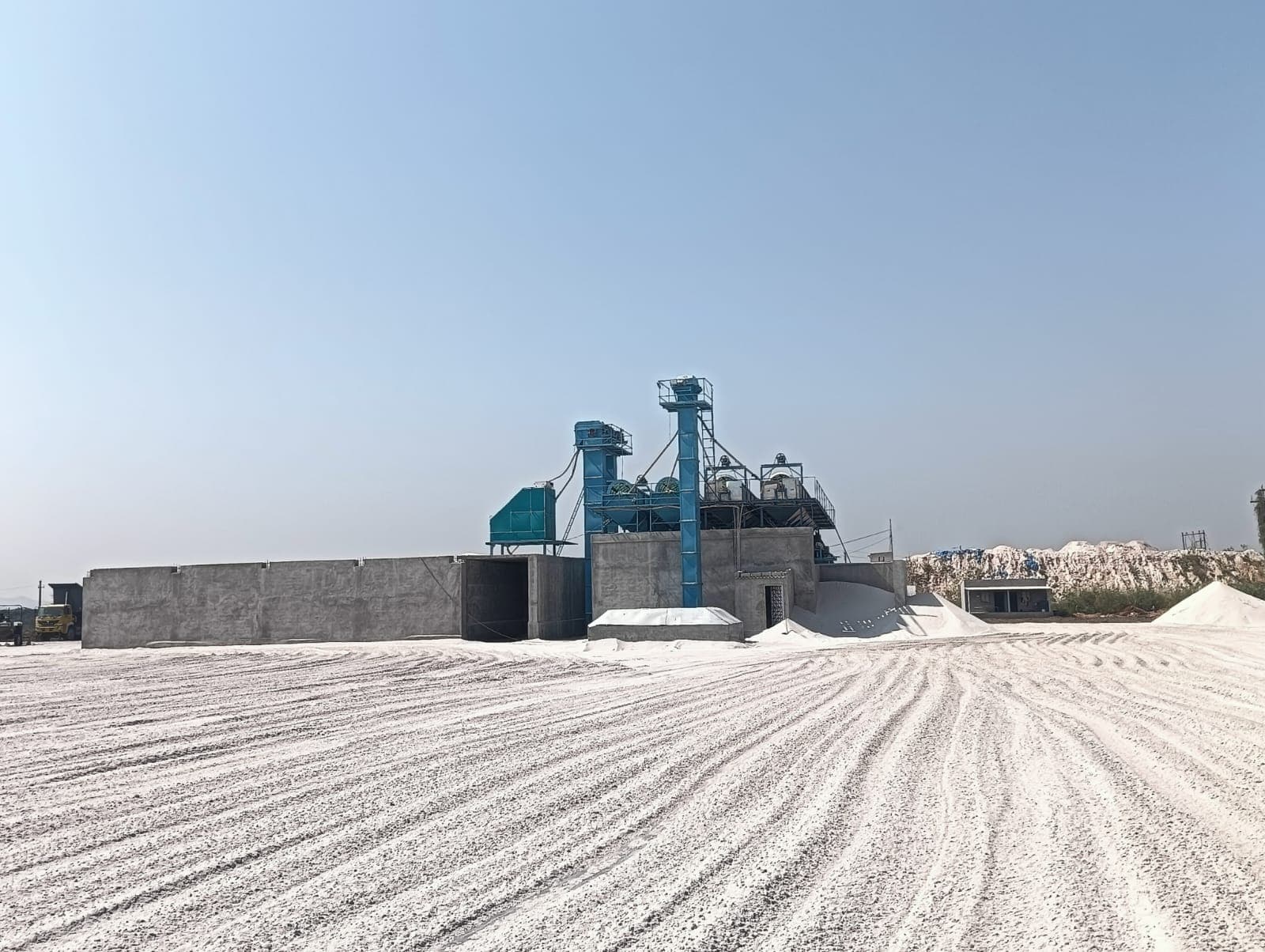 Wide view of the Mahalaxmi China Clay processing plant and yard